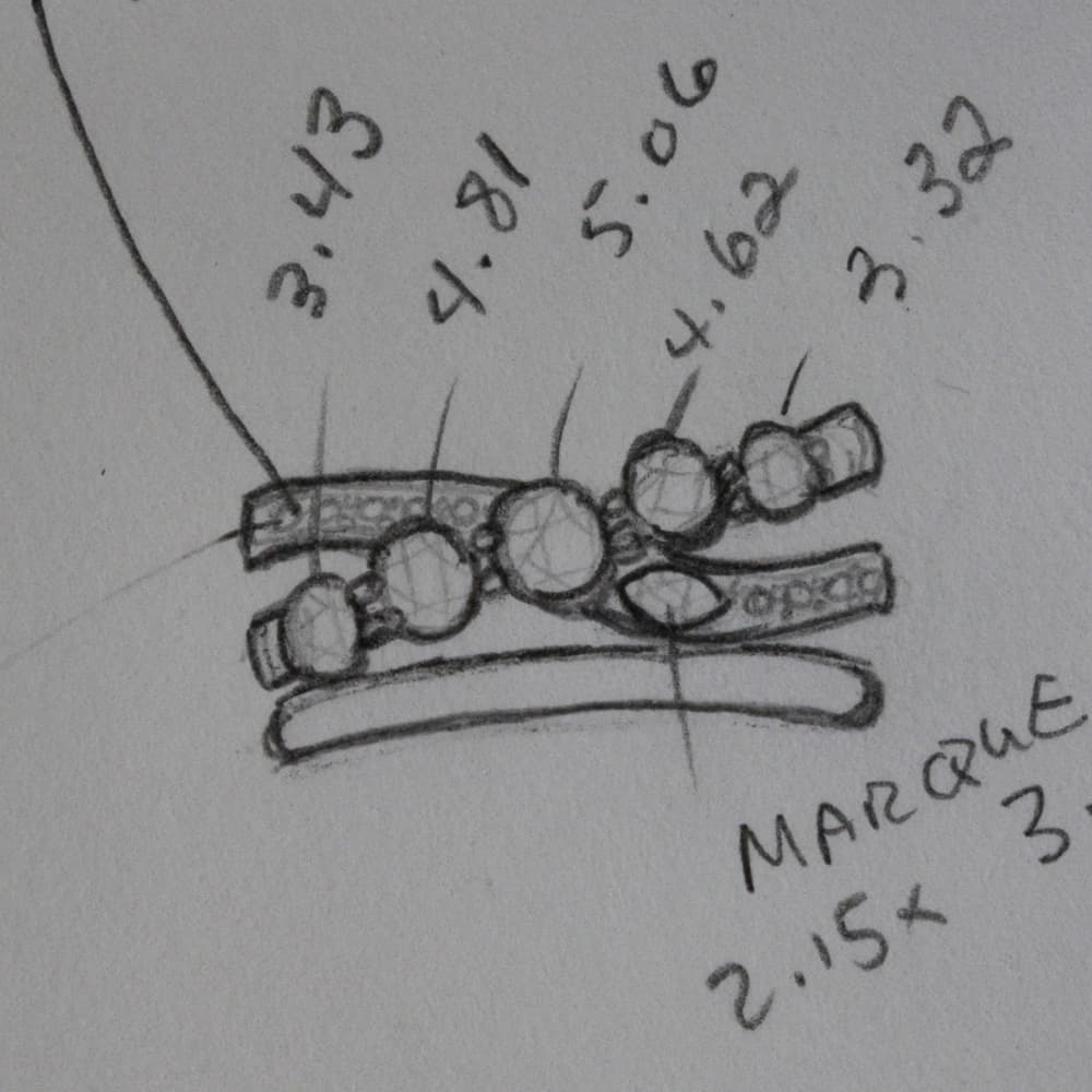 Diagram of a custom ring figuring out measurements of each diamond.