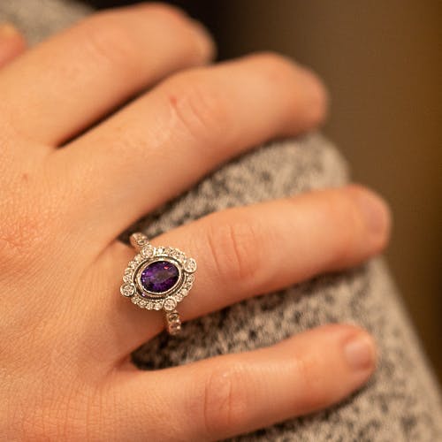 Wearing a purple sapphire halo ring