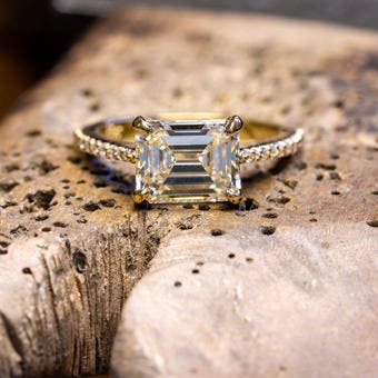 Emerald cut diamond engagement in 18 karat yellow gold