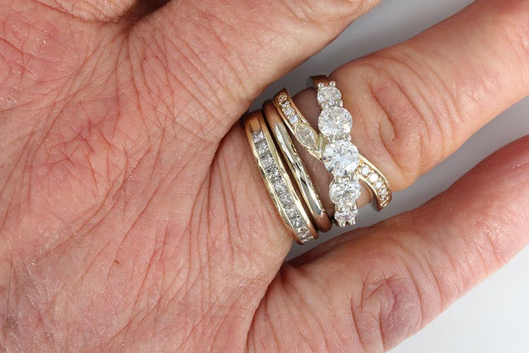 Custom Ring using diamonds inherited from her mom, aunt, and grandmother
