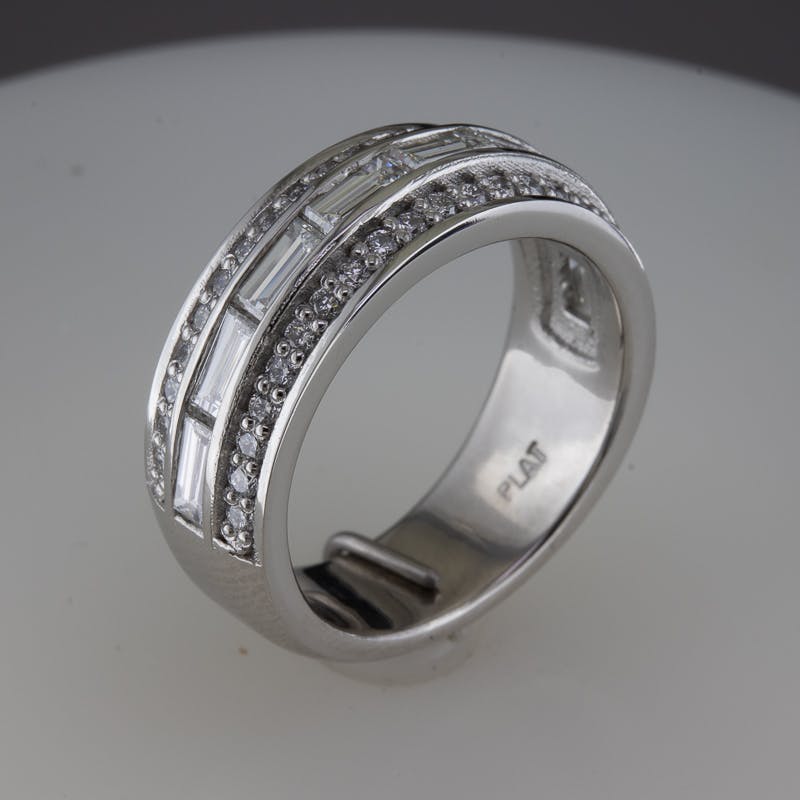 3/4 view of wide baguette and round platinum ring