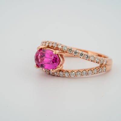 3/4 view of 14 karat rose gold pink sapphire ring with diamond accents