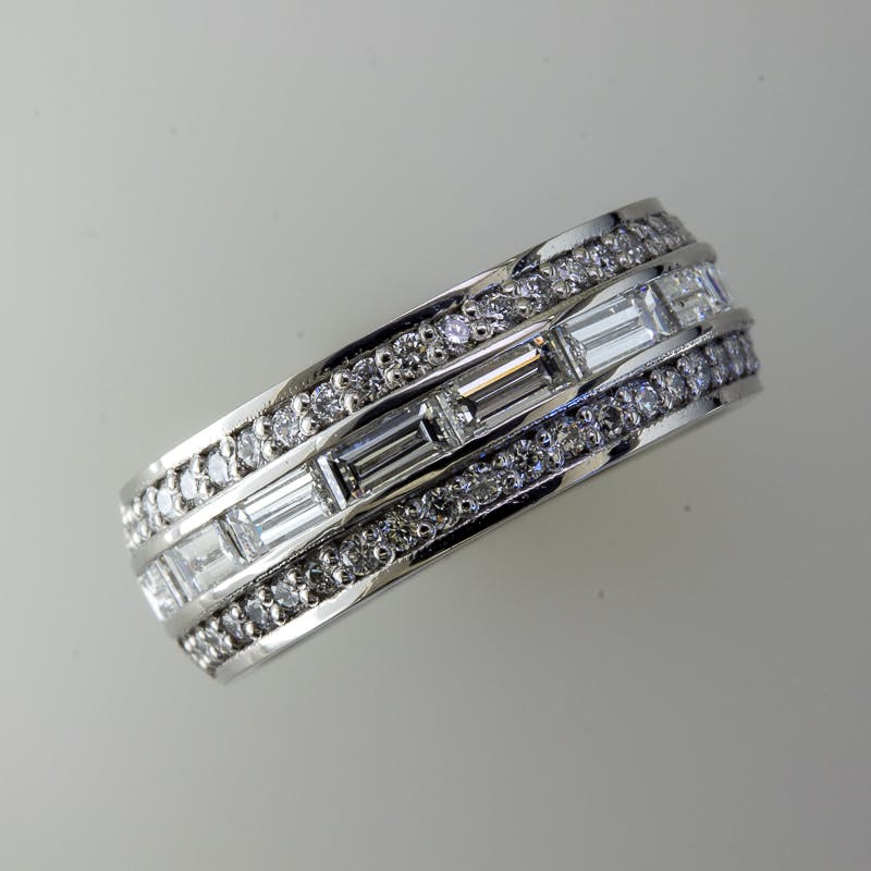 Top view of wide baguette and round platinum ring