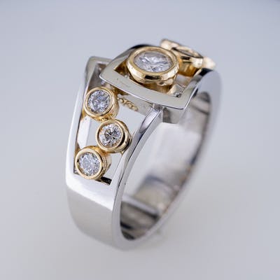 Bezel Set Ring with 7 round brilliant diamonds in flair side view one