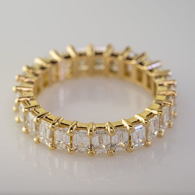 Side view of emerald cut eternity band