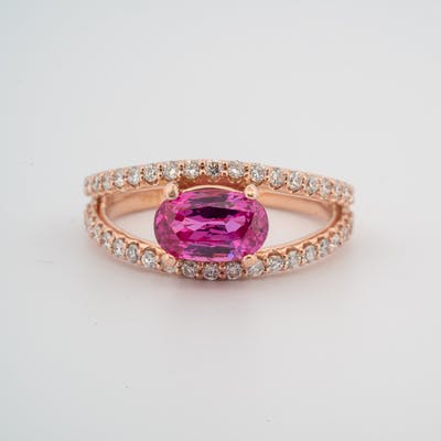 Front view of 14 karat rose gold pink sapphire ring with diamond accents