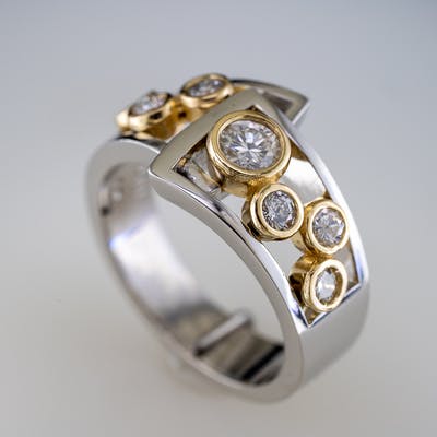 Bezel Set Ring with 7 round brilliant diamonds in flair side view two
