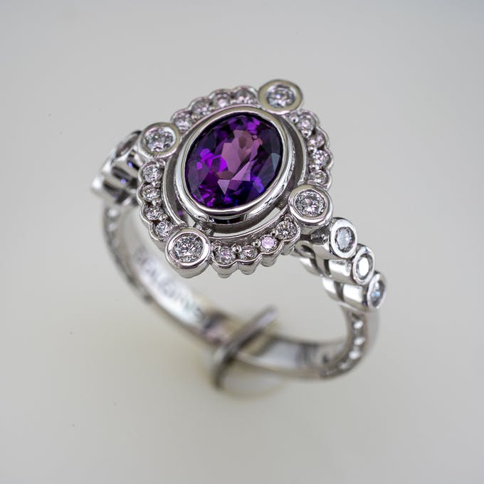 Purple Sapphire Halo Ring Side 3/4 Showing Bezel Set Oval Sapphire