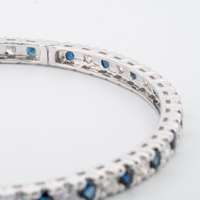 View of clasp and inside in diamond and sapphire bangle bracelet