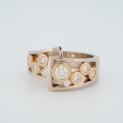 Bezel Set Ring with 7 round brilliant diamonds in flair top view again