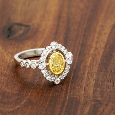 View of the platinum fancy yellow diamond halo ring