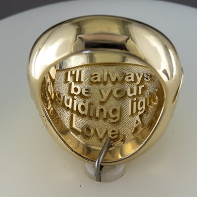View of custom marine compass ring inside message