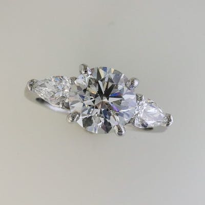 Top view of platinum and round 3 diamond ring 