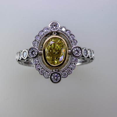 Top view of platinum and fancy yellow diamond ring