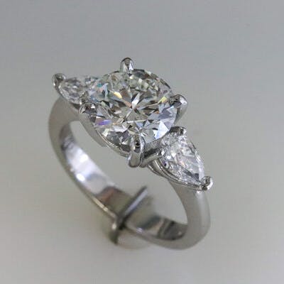 3/4 view of platinum and round 3 diamond ring 