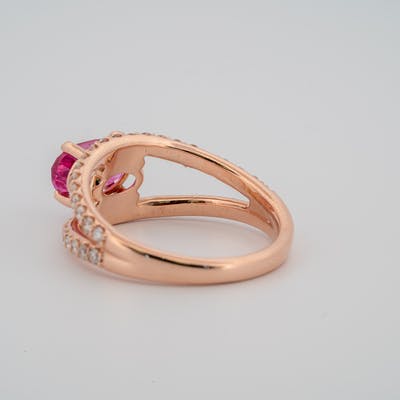 Underneath view of 14 karat rose gold pink sapphire ring with diamond accents