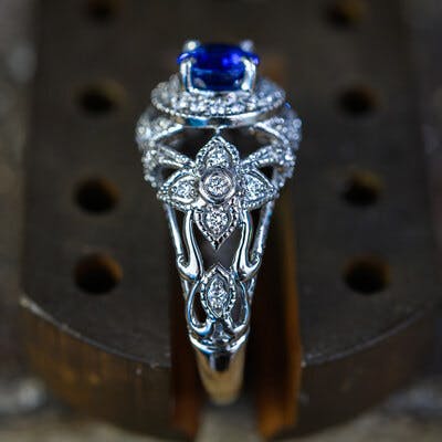 side view of the platinum ring showing the sapphire and diamonds