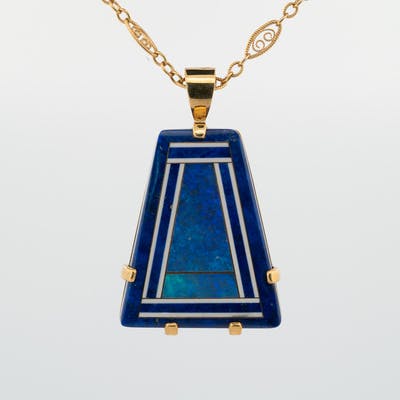 Front view of 18 karat yellow gold lapis and black pendant