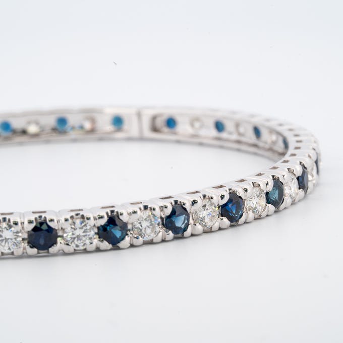 View of sapphires in diamond and sapphire bangle bracelet