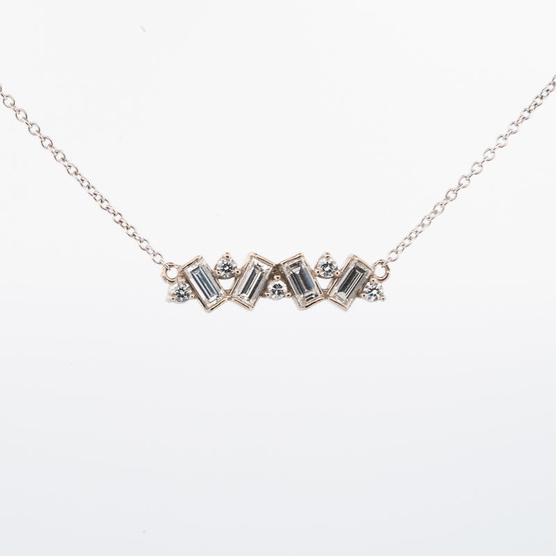 Front View of the bar pendant with baguette and round diamonds