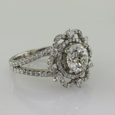 Side view of 2 carat round brilliant platinum snowflake ring