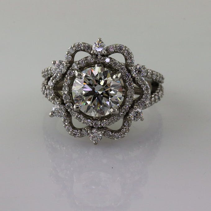 Top view of 2 carat round brilliant in platinum snowflake ring