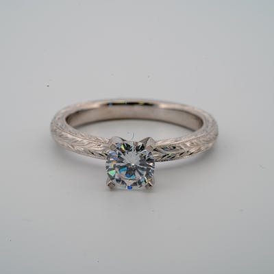 Top view of gold or platinum vintage style engagement solitaire ring